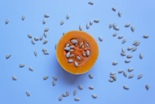 Pumpkin with seeds on a light background. Butternut squash. Concept - organic food, vegetarianism, healthy food.  - Photo, Image