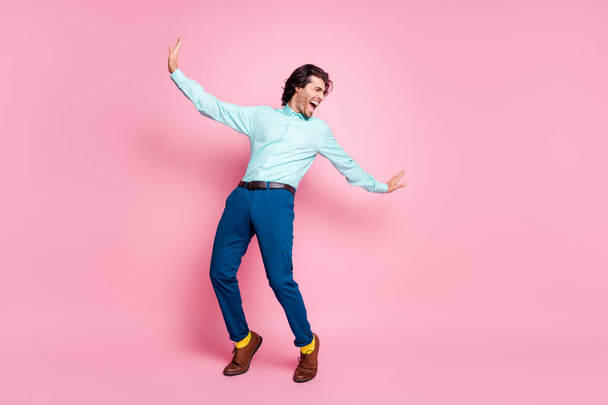 Full body photo of young handsome man crazy have fun look empty space wear yellow socks isolated over pink color background - Φωτογραφία, εικόνα