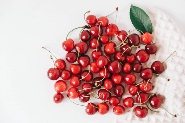 Fresh ripe cherry on the white wooden background. Top view. Copy, empty space for text. - Photo, Image