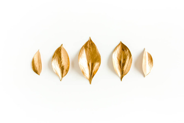 Pattern, texture with gold leaves isolated on white background. flat lay, top view - Valokuva, kuva