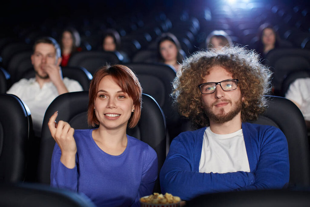 Couple enjoying date in movie theater. - Foto, Bild