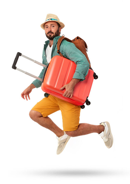 Homme joyeux avec valise sur fond blanc - Photo, image