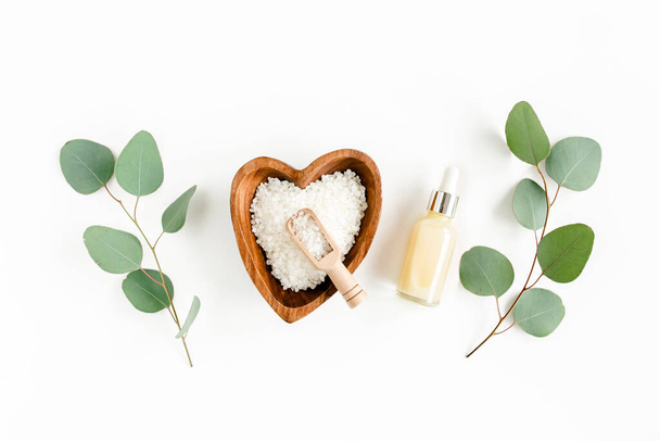Eucalyptus essential oil, eucalyptus leaves on white background. Natural, Organic cosmetics products. Medicinal, Natural Serums. Flat lay, top view. - Fotografie, Obrázek