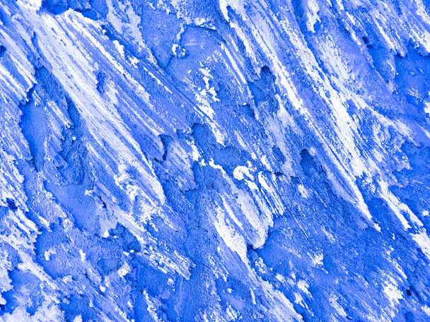 Decorative blue and white background. Embossed abstraction. Blue painterly pattern. White brush strokes on blue background. Rough background with copy space for text. - Photo, Image