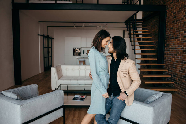  husband and wife talk and make plans for the future in their apartment - Photo, Image