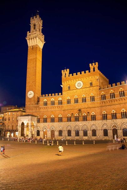 The Palazzo Pubblico is a palace in Siena, Tuscany, central Italy, and its construction began in 1297. - Photo, Image
