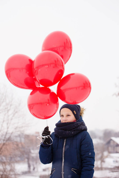 pensive girl with balloons. The concept for St. Valentine's Day - Photo, image