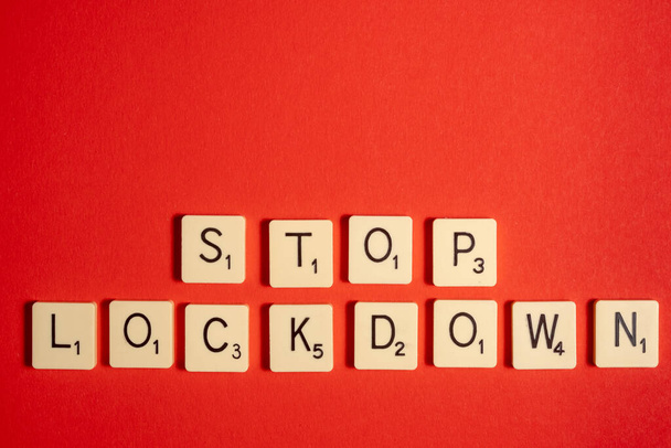 Stop lockdown words on a red background. Copy space. Small business collapse concept. - Photo, Image