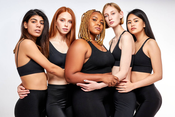 confident diverse models hugging each other - Photo, Image