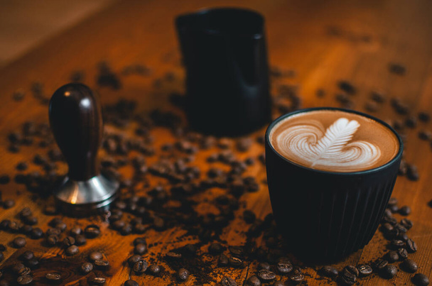 Latte art on the coffee table - Zdjęcie, obraz