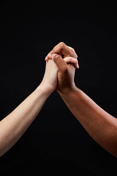 close-up hands holding each other, hand symbol isolated on black background - Fotoğraf, Görsel