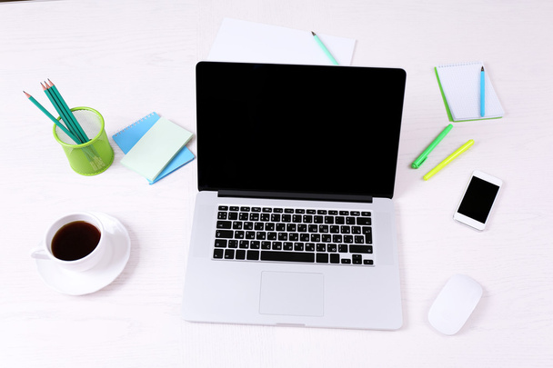 Office workplace with open laptop on wooden desk - Zdjęcie, obraz