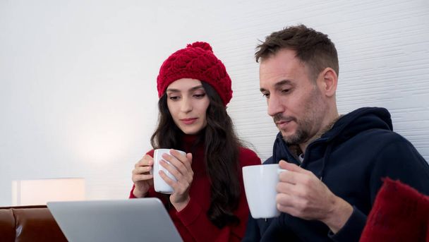 Portrait of couple drinking hot coffee at home  - Photo, Image