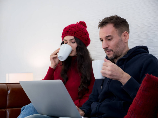 Portrait of couple drinking hot coffee at home  - Photo, image
