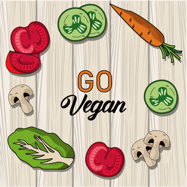 jít vegan písmo plakát se zeleninou kolem v dřevěném pozadí - Vektor, obrázek