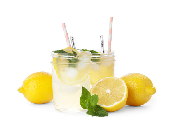 Natural lemonade with mint and fresh fruits on white background. Summer refreshing drink - Fotografie, Obrázek