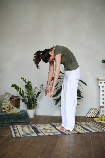 Yoga. Woman doing yoga at home - Photo, Image