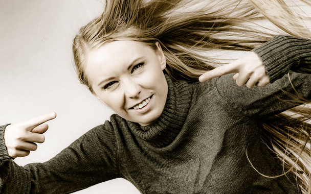 Crazy angry girl with blowing long blonde hair. - Fotografie, Obrázek
