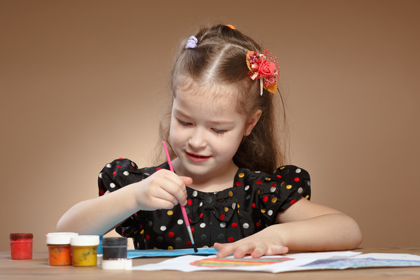 Little girl draws paints in kindergarten - Photo, Image