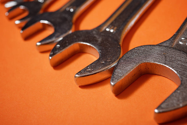 Wrenches on a orange table. - Fotoğraf, Görsel