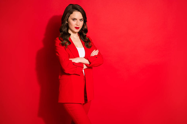 Photo of gorgeous lovely shiny lady cross hands isolated empty space over bright red color background wear jacket pants - Φωτογραφία, εικόνα