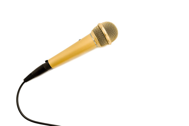 Golden microphone with cable on white background. - Фото, зображення