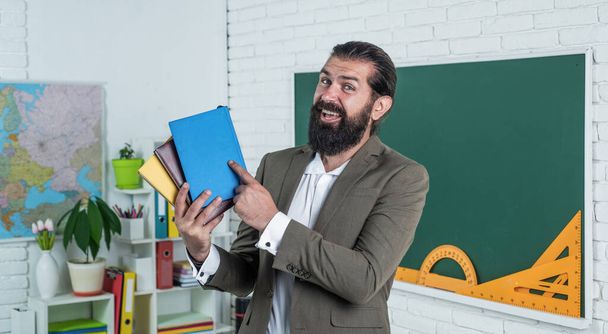 happy teacher with workbook and books ready for lesson, school - Фото, зображення