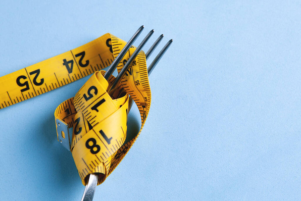 Dieting concept with fork and meter - Fotoğraf, Görsel