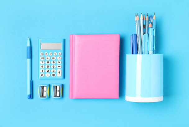 Different stationery on light blue background, flat lay. Back to school - Photo, image
