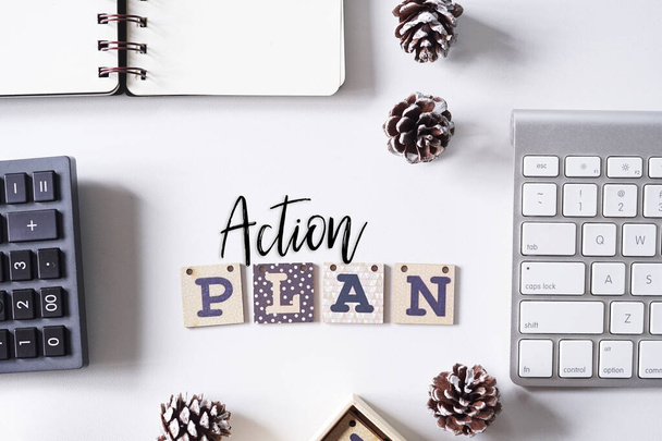 Computer keyboard,pinecones and notebook written with text BUSINESS PLAN on white office table. - Photo, Image