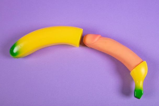 plastic vibrator that looks like a banana, toy for adults - Foto, Imagen