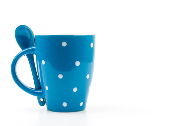 polka mok cup geïsoleerd witte achtergrond - Foto, afbeelding