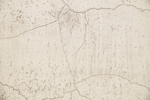 Light gray, old, cracked wall surface. Close-up on a plastered painted wall. - Fotoğraf, Görsel