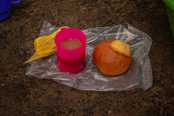 bread and glass of coffee on bag - Valokuva, kuva