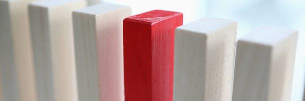White and red wooden blocks stands on a table - Photo, Image