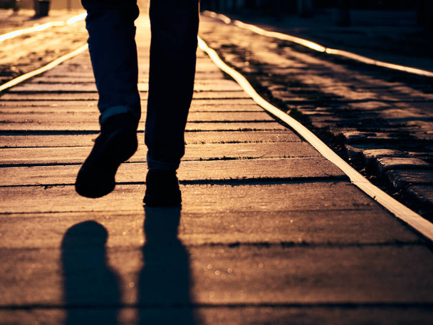 Man on the rails at sunset. - Photo, Image
