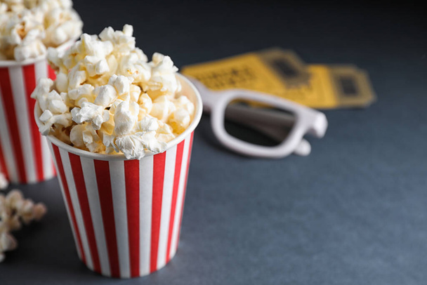 3D glasses, popcorn and cinema tickets on table. Space for text - Foto, Imagem
