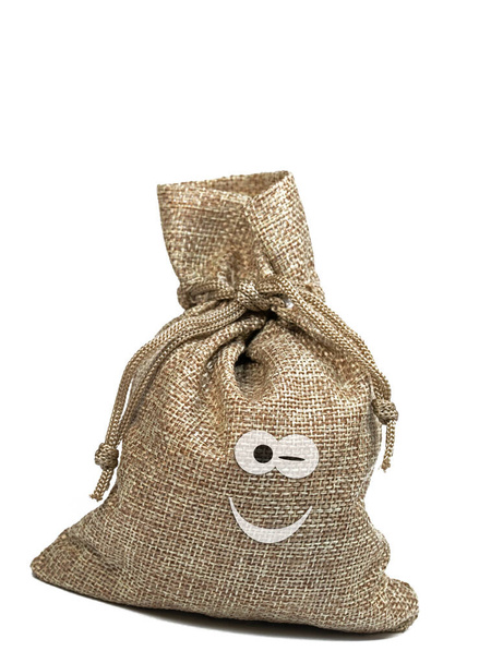 Jute bag with a funny face against a white background - Photo, Image