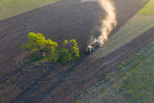 Tractor plowing the field, Pampas countryside, La Pampa, Argentina - Photo, Image