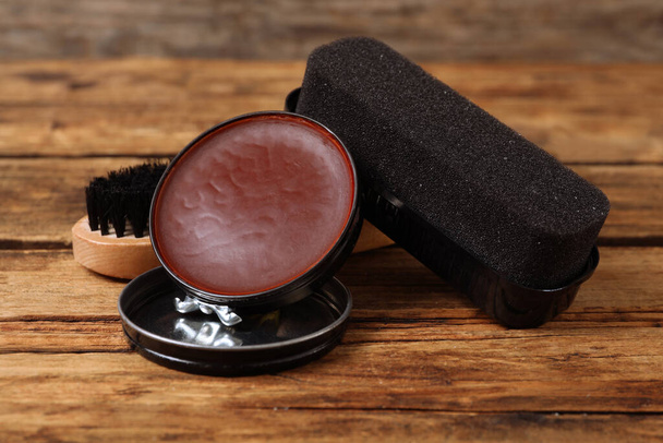 Shoe care accessories on wooden background, closeup - 写真・画像