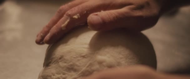 Chef checking the shape of the traditional pizza dough. Close up, slow motion - Footage, Video