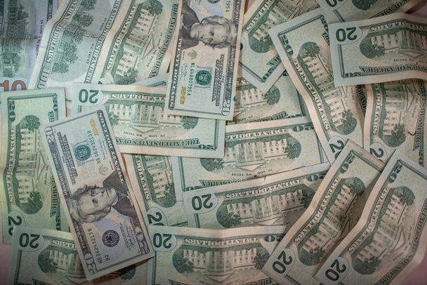 Stack of US 20 and 100 dollar bills as a background. Top point of view. - Photo, Image