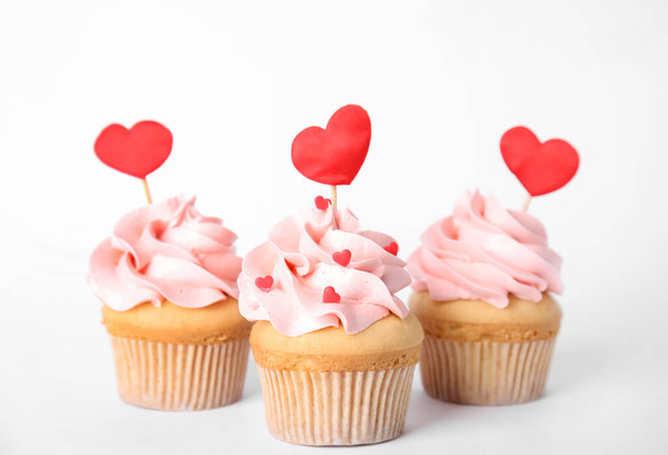 Tasty cupcakes for Valentine's Day on white background - 写真・画像