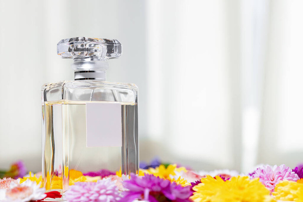 Perfume bottle for women in flower buds - Photo, image