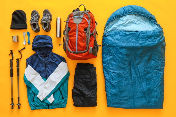 Equipment for hiking on color background - Photo, image