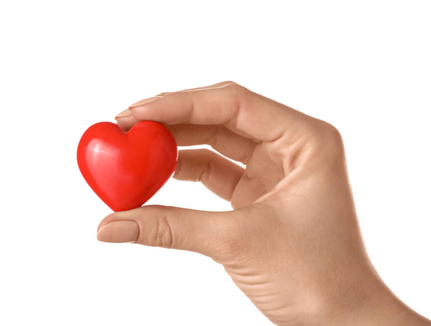 Hand with red heart on white background - Photo, Image