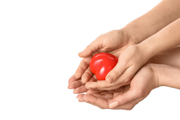 Hands with red heart on white background - Photo, Image