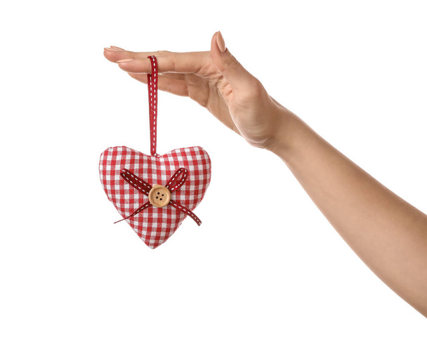Hand met decoratief hart op witte achtergrond - Foto, afbeelding