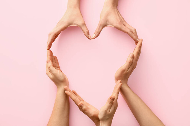 Hands making heart on color background - Photo, Image