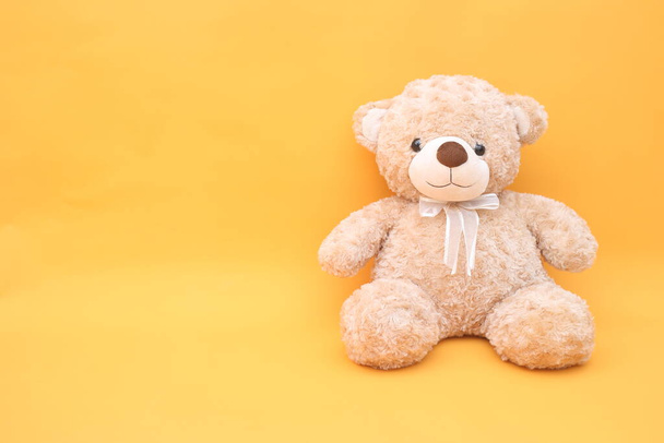 Teddy bear on yellow background  - Photo, Image